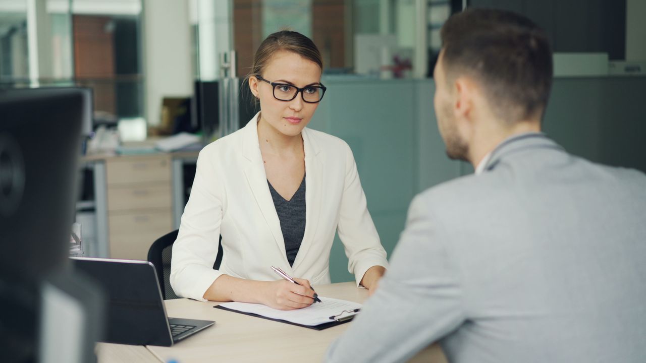 HR professional welcoming a new employee