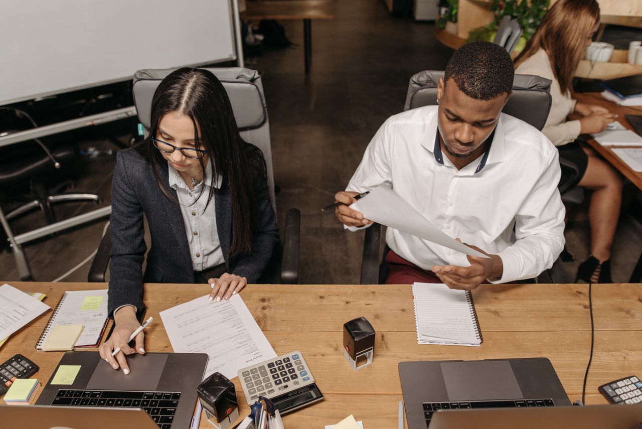 HR professional reviewing employee background screening documents